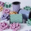 P scented curling ribbon spools in pastel colors with star patterns for decorations, gift wrapping, and celebration parties, high-quality party accessories, festive and colorful curly bows.
