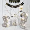 HAPPY BIRTHDAY банер с балони и златисти декорации за тържество в ефирна бяла стая.