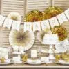 Candles and gold decorations for wedding celebration.