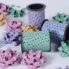 P scented curling ribbon spools in pastel colors with star patterns for decorations, gift wrapping, and celebration parties, high-quality party accessories, festive and colorful curly bows.