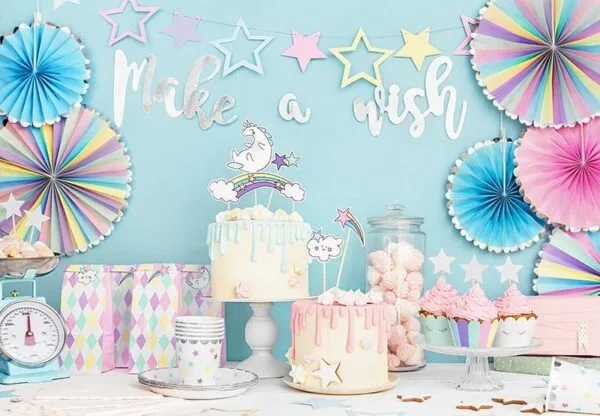 Make a wish, party balloons, unicorn cake, pastel decorations, birthday celebration, children's party supplies, cake with rainbow top, cupcake display, party decor set, festive dessert table.