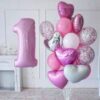 розова балонена композиция с голяма цифра "1" за рождени дни, съчетаваща сърца и звезди, идеална за празнични събития, украса за първи рожден ден.