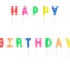 Хапи свещи за рожден ден, ярки цветове, с букви за празнуване, декорация за тортата, детски празник, парти украса, весел детски рожден ден, рождени свещи, празнична атмосфера.