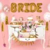 Балонени букви "BRIDE" с розов фон и празнична декорация за сватбени партита и bridal shower. Идеално за украса при подготовката за сватбено тържество или фотосесия.